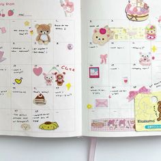 an open planner book with stickers on the pages and teddy bear images in it