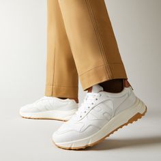 Characterized by smooth and dynamic forms, these men's Hogan Hyperlight sneakers combine the jogging shoe lines and urban features. The nappa leather upper recalls iconic details of the brand and is enhanced by a side H. An ultra dynamic style, with a memory foam insole and a lightweight outsole with spikes inspired by the historic H383 style. Modern Sneakers With Vibram Sole For Jogging, Modern Jogging Sneakers With Vibram Sole, White Leather Running Shoes For Jogging, Modern Running Shoes With Vibram Sole For Jogging, Modern Leather Running Shoes With Textured Sole, Modern Leather Running Shoes With Cushioned Footbed, Modern White Leather Running Shoes, Modern Calf Leather Sneakers For Sports, Modern Sneakers With Textured Sole For Jogging