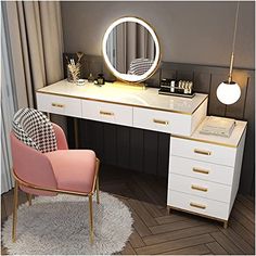 a white desk with a chair and a round mirror