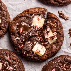 chocolate cookies with candy canes and peppermint on top