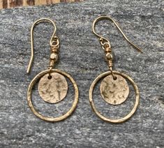 "MATERIALS These hand crafted earrings have two 14k gold filled circles. They are lightweight & so comfortable on your ear. They are gently hammered & wired to a gold filled bead. You may choose between regular or lever back styled gold filled ear wires. These are a perfect pair of earrings for every day wear! MEASUREMENTS Length 1 3/8\" regular wires 1 5/8\" lever back wires 5/8\" wide PACKAGING Each jewelry purchase is secured in a gift giving jewelry box & then wrapped up with tissue paper. I Hypoallergenic Round Earrings In Recycled Gold, Adjustable Hammered Earrings For Anniversary, Adjustable Hammered 14k Gold Earrings, Casual Gold Earrings, Earrings Casual, Crafted Earrings, Boho Lifestyle, Disc Earrings, Hand Made Jewelry