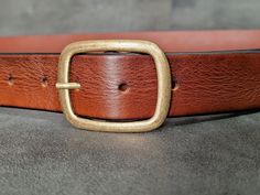 "This quality smelt unique oval buckle geniune leather belt, handmade for you. Made of 3mm. thick full vegetabled tanned calf leather, shaped by hand craft. Each edge is handcrafted. Thanks to the property of the leather used in its construction İt will shine and flourish as it is used. An elegant belt to be used for many years *It can be used for either men or women. -Leather Colours; *Black *Brown *Brandy  *Tan *Belt buckle and screw pin color is antique siver or antique gold  (Please choose) *Hand sewing rope. Abaut Size; *Measure your belt from the bottom of the buckle to the 3rd hole, this is the belt size you will choose. (I will add 6\" to this size) Please compare the size of a belt that fits your waist.  Check the size chart in the last picture. * Please send me a message other th Elegant Belt, Christmas Gift For Women, Tan Belt, Handmade Belts, Denim Belt, Beautiful Belts, Hand Craft, Brown Leather Belt, Brown Belt