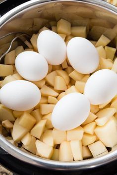 eggs and potatoes are in an instant pot on the stove top, ready to be cooked