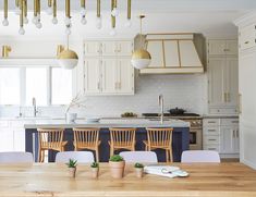 Kitchen Remodel with Modern Finishings and Gold Hardware Kitchen Navy Island, Modern Cream Kitchen, Kitchen Navy, Navy Island, Industrial Kitchens, Industrial Kitchen Design, Cream Kitchen