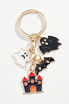 a keychain with three different types of halloween decorations hanging from it's side