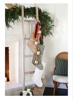 christmas stockings hanging from an old wooden ladder