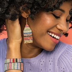 Lovers of petite fringe earrings, these are just what you need! Lightweight, yet impactful, these Luxe glass beads offer shimmer + shine like no other. Style tip: Team member Kim styles these multicolor-striped beauties on the regular. As we say around here, there's nothing that a rainbow + gold accessory can't coordinate with. --DETAILS-- 3.25" L x 1.08" W Handmade by skilled artisans in India Hypoallergenic nickel + lead-free brass hardware These accessories are made by human hands. A slight v Fringe Earring, Striped Earrings, Gold Fringe, Shimmer Shine, Human Hands, Gold Line, Trendy Earrings, Beaded Fringe, Gold Stripes