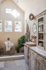 a bathroom with a sink, mirror and cabinet in it's center area is shown