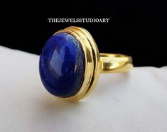 Lapis Lazuli Ring Raw Gemstone September Birthstone | Etsy Denmark Formal Lapis Lazuli Ring Jewelry, Celestial Gemstone Rings For Formal Occasions, Handmade Yellow Gold Gemstones For Anniversary, Gold Round Gemstones For Anniversary, Celestial Yellow Gold Cabochon Rings, Celestial Style Cabochon Yellow Gold Rings, Anniversary Yellow Gold Lapis Lazuli Rings, Celestial Style Yellow Gold Sapphire Ring Gift, Elegant Sapphire Moonstone Ring As Gift