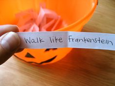 a hand holding a piece of paper that says walk like frankensten printable