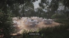 an outdoor dining area with tables and chairs set up on a wooden deck surrounded by trees