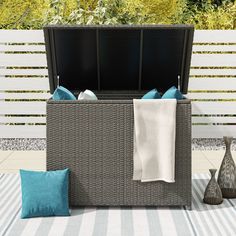 Protect your outdoor cushions from the elements and add some extra seating with this cushion storage box. With weather-resistant resin wicker and waterproof lining, this storage bench ensures your cushions stay dry and free from sun damage. Octans 46.4-in x 28.7-in Gray Outdoor Storage Shed | SL2C00098 Small Outdoor Storage, Cushion Storage, Outdoor Storage Shed, Patio Storage, Deck Box, Outdoor Storage Sheds, Cover Style, Pool Toys, Fire Table