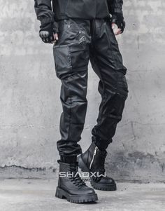 Design: Techwear, Ninja Techwear, Cyberpunk, Military, Futuristic Technical pants: This techwear pants is the perfect garment to complete your Techwear outfit. Breathable materials: This techwear cargo pants made of polyester, cotton and spandex can be worn all year round. Suitable for men and women Machine washable: 30 °C (86 °F) FREE worldwide shipping These multi pocket cargo pants have a straight cut and 4 front pockets. 2 large pockets and 2 small pockets that close with a button. These pan Winter Techwear Parachute Pants, Cyberpunk Streetwear Parachute Pants With Cargo Pockets, Cyberpunk Cargo Pants For Streetwear, Black Cyberpunk Pants For Outdoor, Cyberpunk Black Pants For Outdoor, Cyberpunk Black Outdoor Pants, Techwear Bottoms With Cargo Pockets For Urban Adventures, Techwear Cargo Pants With Multiple Pockets For Urban Adventures, Nylon Cargo Style Techwear Pants