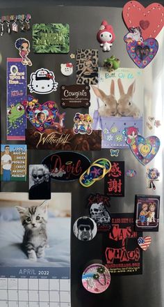 a refrigerator covered in magnets and pictures