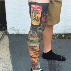 a man with his legs covered in tattoos