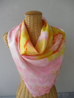 Silk scarf, hand painted. The colors used, golden yellow, pink and coral, blend or clash, depending on your mood. This unique creation will appeal to refined women. Very easy to maintain (care instructions provided), it will enhance your outfit. Hand rolled hem. Dimensions of the scarf: 90cmX90cm This scarf can be made in other colors, (manufacturing time 15 days) do not hesitate to contact me so that we can finalize your project Packaged with care, this item comes with gift packaging. Shipping Spring Yellow Scarves, Yellow Silk Scarf For Spring, Yellow Bohemian Silk Scarf For Spring, Pink Silk Scarf For Summer Gift, Handmade Pink Silk Scarves, Pink Scarf As Summer Gift, Pink Scarves For Summer Gifts, Pink Hand-dyed Scarf, Pink Hand Painted Silk Scarves