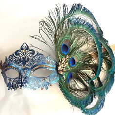 This filigree laser cut mask painted in Navy Blue and embellished with Rhinestones and adorned with Peacock feathers. If you pick the custom stone option, leave a note during check out with the colors you would like and a contact number to send pics for approval. Thank you for supporting small businesses and hope our products bring you and loved ones some joy and humor in these trying times. S H I P P I N G - Current processing times range 5-7 days. Pls note expedited & 1-2 day guaranteed de Masquerade Mask Women, Elegant Face Mask, Venetian Masquerade Masks, Feather Mask, Mask Painting, Venetian Masquerade, Carnival Festival, Blue Peacock, Mardi Gras Mask