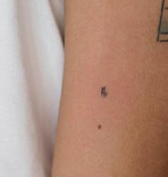 a person with a small tattoo on their arm