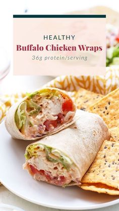 healthy buffalo chicken wraps on a plate with tortilla chips and salad in the background