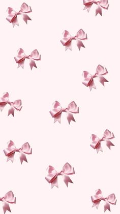 many pink bows are flying in the air