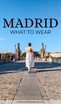 a woman walking down the street with text overlay reading madrid what to wear