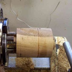 a close up of a machine that is working on some kind of woodworking project