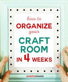 two hands holding up a sign that says how to organize your craft room in 4 weeks