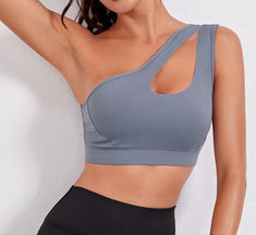 FlexEase Single Shoulder Sports Bra, a perfect blend of style and support designed for women who prioritize both fashion and functionality in their fitness wardrobe. This sports bra boasts a sleek and modern design, featuring a single shoulder strap that not only adds a touch of flair but also ensures maximum flexibility during workouts. The stylish silhouette is complemented by the strategic construction that provides excellent support, making it an ideal choice for various fitness activities.