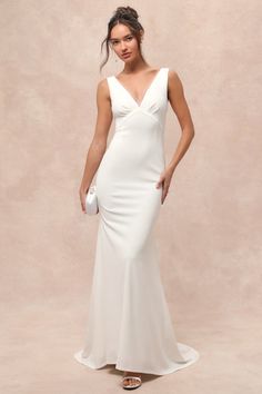 You'll have your beloved mesmerized for life when you step out in the Lulus Captivating Promise White Sleeveless Mermaid Maxi Dress! This modern gown has a stretchy crepe knit fabrication that forms wide tank straps with a sheer mesh trim that flows into the plunging V-neckline and matching V-back. Light gathering accents the triangle-style bodice with an empire waist that falls to a mermaid maxi skirt with a romantic train at the back. Hidden back zipper/clasp. Fit: This garment fits true to size. Length: Floor length. Size medium measures 61.5" from shoulder to hem. Bust: Great for any cup size. Waist: Fitted - very fitted at natural waist. Hip: Loosely Fitted. Undergarments: May be worn with petals, or no bra. Fabric: Fabric is very stretchy. Lined. Dress Measures 11" Longer At Back. Sh Mermaid Maxi Skirt, Modern Gown, Mermaid Maxi Dress, Maxi Dress Sleeveless, Maxi Skirt Dress, White Sleeveless Dress, A Mermaid, White Sleeveless, Mermaid Dresses