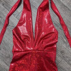 Made of our holographic red shattered glass spandex, this halter romper hugs the body, but offers plenty of stretch. The halter top ties at the back of the neck. Our seamless front design is extremely comfortable and prevents camel toe. Wear this to a rave, to a festival, or an aerial performance. this is perfect for your Olivia Rodrigo outfit. Party Backless Halter Top With Back Opening, Red Fitted Halter Top For Night Out, Fitted Red Halter Top For Night Out, Sleeveless Halter Top With Back Opening For Party, Party Stretch Halter Top With T-back, Red Sleeveless Halter Top For Party, Stretch T-back Halter Top For Party, Fitted Halter Top With Back Opening For Party, Fitted Red T-back Halter Top