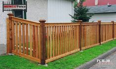 a wooden fence in front of a house