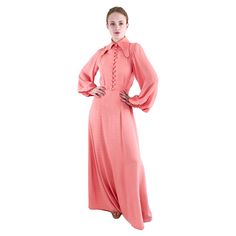 This iconic 1970's Ossie Clarke dress is a must-have for vintage lovers. Made from silky crepe fabric, this salmon pink button up dress features the designer's signature style and will add a timeless elegance to your wardrobe. Condition: Excellent Vintage Condition Material: Silk Crepe Sleeve Style: Long Sleeves Neckline: Button up with Collar Closure: Buttons Details: Long Sleeves, Buttons, Silk Crepe fabric, collar Length: Maxi length Care Instructions: Dry clean only Measurements: Shoulder: 1 Colorful Gown, Ossie Clark, Crepe Maxi Dress, Roberto Cavalli Dress, Vintage Lovers, Empire Waist Dress, Dress Home, Button Up Dress, Paisley Dress