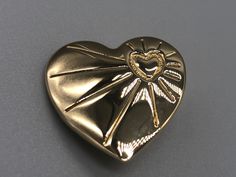 A beautiful vintage gold tone variety club heart brooch.  Approximate measurements  Length - 2.8 cm Width - 2.8 cm  * Due to this item being vintage there may be markings on the piece. Please view the video and photos to see the condition of the jewellery. Vintage Gold Brooches For Valentine's Day, Gold Brooches For Valentine's Day, Gold Brooches For Formal Valentine's Day, Gold Brooches For Valentine's Day Formal, Gold Heart-shaped Brooches For Gifts, Gold Heart-shaped Brooch For Formal Occasions, Gold Heart Brooch For Formal Occasions, Gold Heart Brooch For Formal Wear, Heart-shaped Gold Pins For Gifts