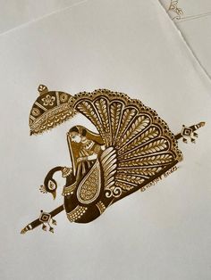 an intricately designed piece of paper with a peacock on it's back side