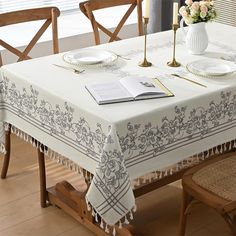 a dining room table with a book on it