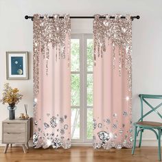 pink curtains with silver sequins and flowers on them in front of a window