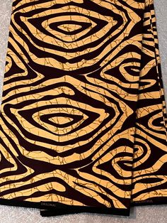 This striking bold motif with beautiful and bright colours is a modern take on African fabric. The fabric is 100% cotton and made in Nigeria. A high quality African wax print is ideal for clothing, accessories and any craft or sewing projects requirements. If you order more than one yard, we will cut multiple lengths purchases in a continuous length piece. However, please note that this fabric comes in bolts of 6yards.  Kindly note that we have taken every effort to remain true to the colours of East African Fabric Patterns, African Print Fabric Background, Ankara Fabric With Unique Pattern Prints, Traditional Brown Ankara Fabric, West African Textiles, Yellow Ankara Fabric, African Textiles, African Wax Print, Wax Print