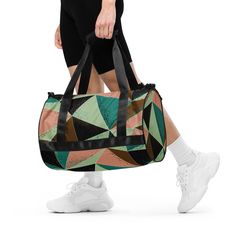 Ready to get your fitness on? Add some punch to pumping iron with this all-over print gym bag. Made from 100% polyester and sturdy, water-resistant fabric, this bag is fun meets function. And it's got pockets!  * 100% polyester * Fabric weight: 9.91 oz/yd² (336 g/m²)  * Water-resistant and durable  * Sturdy fabric with fusible backing to add firmness  * T-piping for stability  * Dual padded handles  * Inside pocket for valuables This product is made especially for you as soon as you place an ord Large Capacity Gym Bag, Sporty Nylon Bags For Training, Sporty Nylon Training Bag, Sporty Green Gym Bag For Sports, Practical Green Sports Travel Bag, Sporty Green Gym Bag, Green Rectangular Gym Bag For Sports, Functional Green Sports Duffle Bag, Multicolor Sporty Bags For Sports