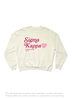 a white sweatshirt with the words stigma kapa on it and a heart in pink