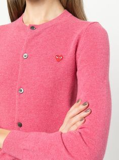 Pink wool small heart cardigan from COMME DES GARÇONS featuring heart motif, round neck, front button fastening, long sleeves and ribbed hem. | Comme des Garcons Small Heart Cardigan Designer Sweater With Buttons, Casual Pink Cashmere Cardigan, Cdg Cardigan, Cute Pink Cardigan With Button Closure, Pink Heart Cardigan, Pink Button-up Knit Cardigan, Casual Pink Heart-shaped Sweater, Heart Cardigan, Play Comme Des Garcons