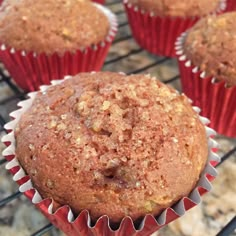 several muffins sitting on top of a cooling rack