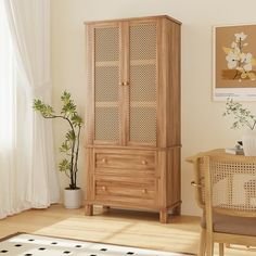 a wooden cabinet sitting in the corner of a living room next to a table and chair