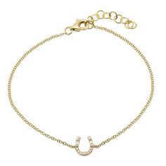 Elegant gold bracelet with a sparkling horseshoe charm, embodying luck and sophistication from our premium jewelry collection. Horseshoe Bracelet, Hummingbird Necklace, Heart Necklace Diamond, Nameplate Necklace, Medallion Necklace, Baguette Cut Diamond, Initial Jewelry, Baguette Cut, Diamond Bracelets