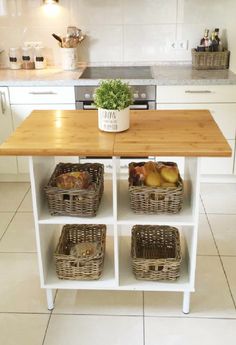 a kitchen island with three baskets on it