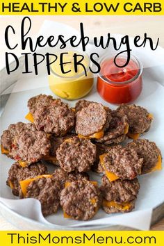 hamburger patties with mustard and ketchup on a plate