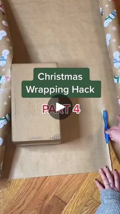 someone is wrapping christmas presents in a cardboard box with the words, christmas wrapping hack part 4