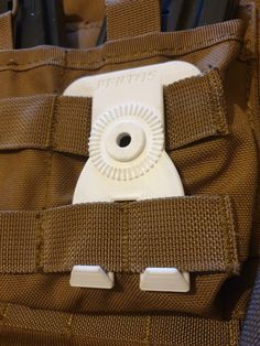 a close up of a cell phone in a pouch with other items inside it and on the back pocket