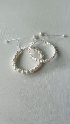 Pearl adjustable wax string bracelets in 2 different options , perfect for any occasion! Elegant Adjustable Friendship Bracelets With Sliding Knot, White Resizable Braided Bracelets With Waxed Cord, White Waxed Cord Friendship Jewelry, Adjustable White Waxed Cord Friendship Bracelets, White Braided Bracelet With Adjustable Length As Gift, White Adjustable Braided Bracelet As Gift, White Macrame Friendship Bracelets As Gift, Adjustable Hand Wrapped White Friendship Bracelets, White Waxed Cord Bracelet Perfect For Gifting