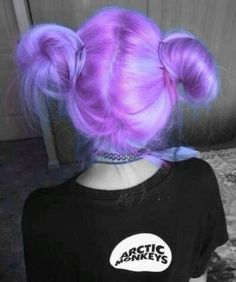 the back of a woman's head with purple hair