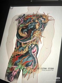 an image of a dragon tattoo on the back of a person's arm and leg